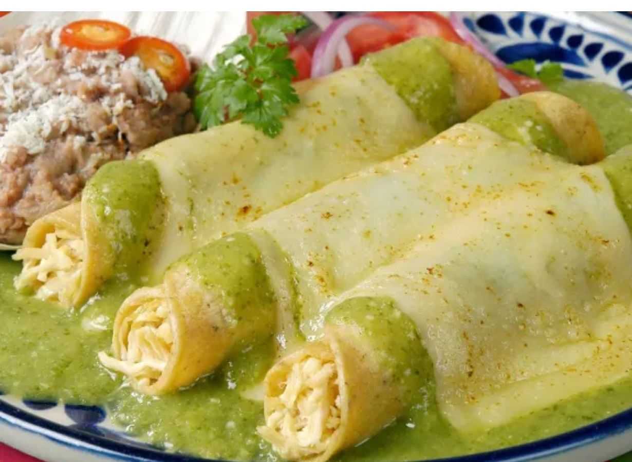 Green Sauce Enchiladas with clipping path Authentic Mexican enchiladas with melted cheese